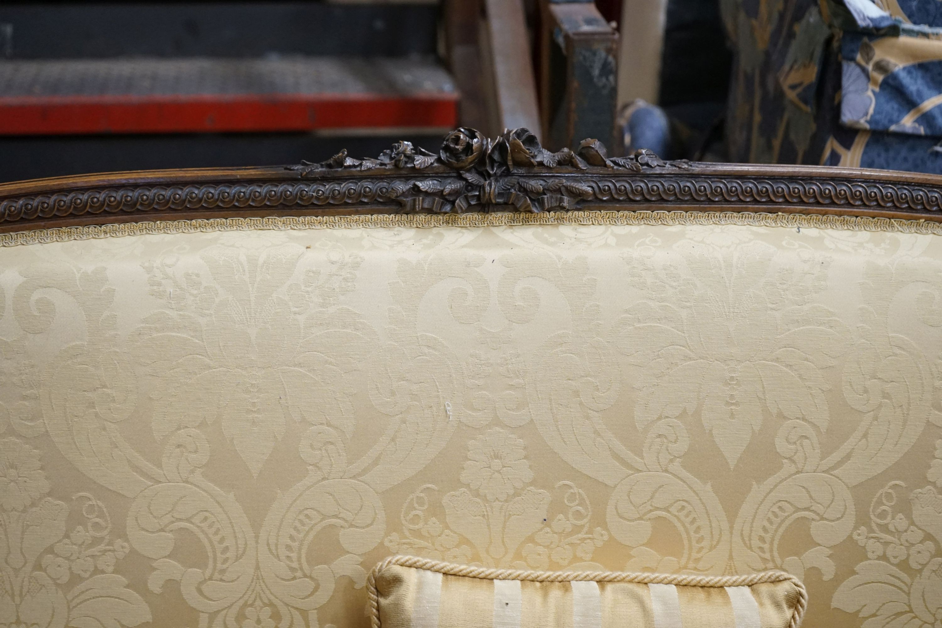 A 19th century Continental carved walnut upholstered settee, length 144cm, depth 54cm, height 104cm